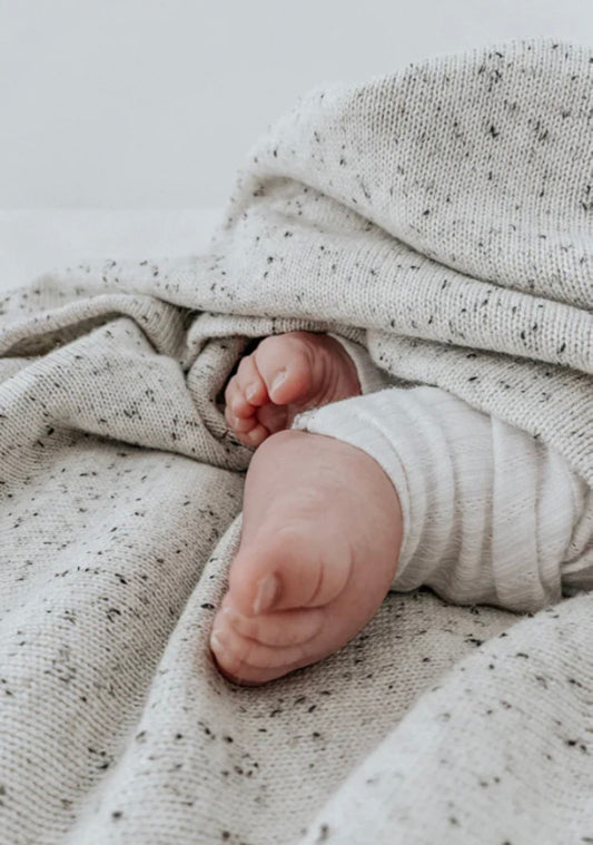 White flecked baby blanket